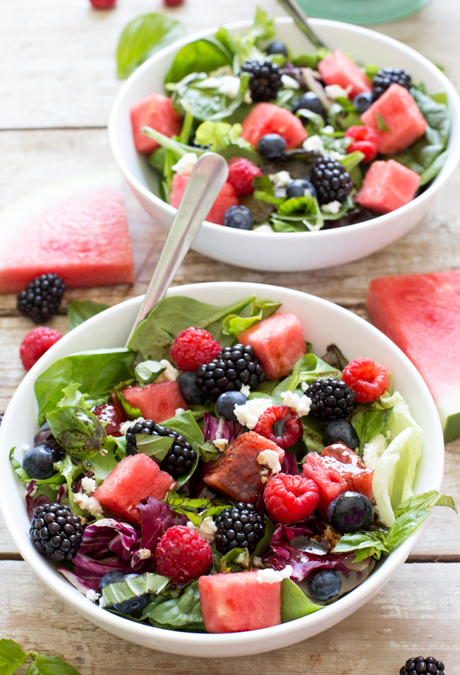 Watermelon Feta Salad loaded with tons of fresh berries and basil. Drizzled with a Simple Balsamic Vinaigrette. A light and refreshing summer salad!