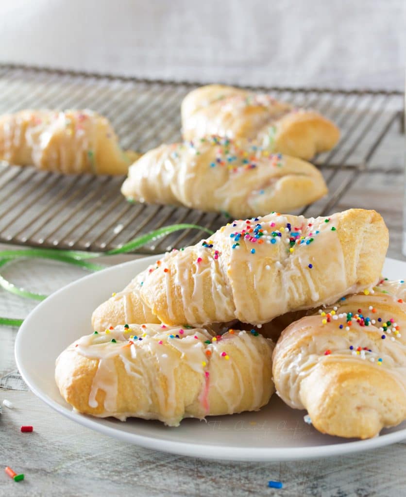 Buttery crescent rolls filled with a funfetti cream cheese spread make these Funfetti Crescents a one of a kind dessert that is super easy to make, and FUN!  Rich, buttery, sweet, colorful, and perfect for getting your kids into the kitchen to help!