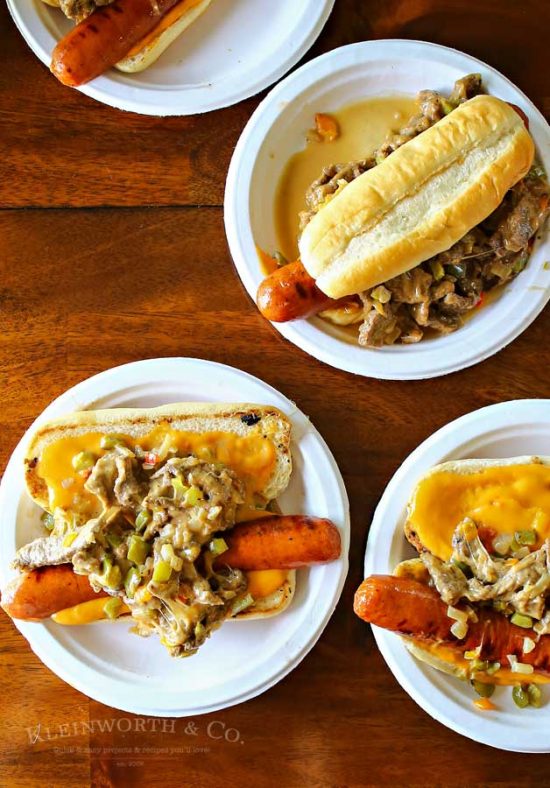 The Philly Cheesesteak Hot Dog is a twist on two iconic food recipes. Combining grilled hot dogs & the best philly cheesesteak recipe is over the top amazing!