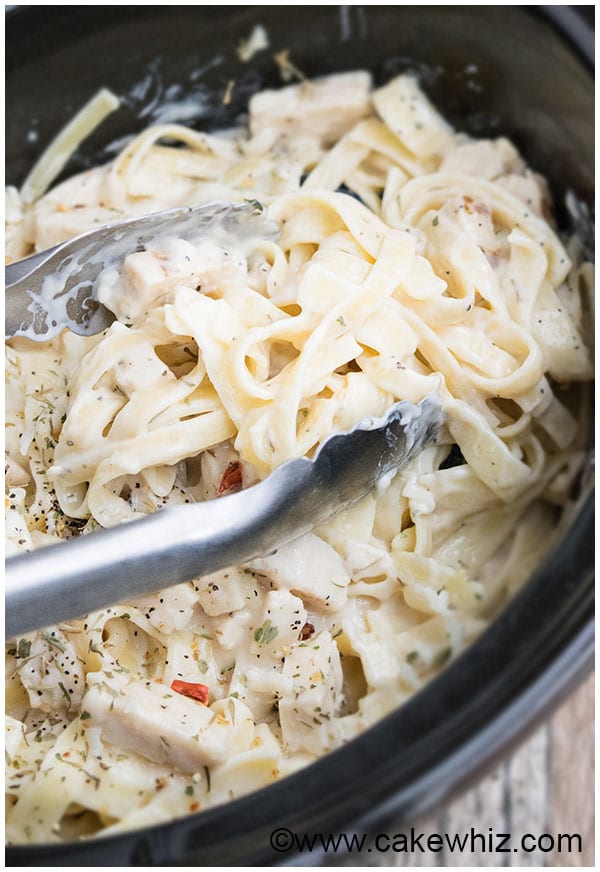 This SIMPLE crockpot chicken alfredo recipe is kid-friendly and absolutely delicious!