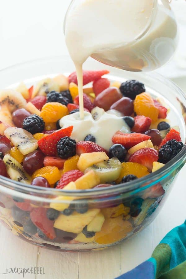 This Creamy Fruit Salad Recipe is made with a Homemade Vanilla Dressing —  It is the perfect summer breakfast, snack or dessert — use whatever fruit you have! 