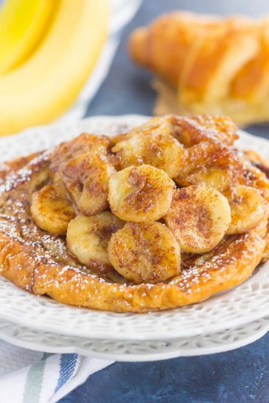 This Cinnamon Banana Croissant French Toast features thick slices of flaky, buttery croissants that are sprinkled with a cinnamon mixture and topped with caramelized bananas. Simple, fresh, and bursting with a rich flavor, this is the perfect way to switch up your french toast routine!