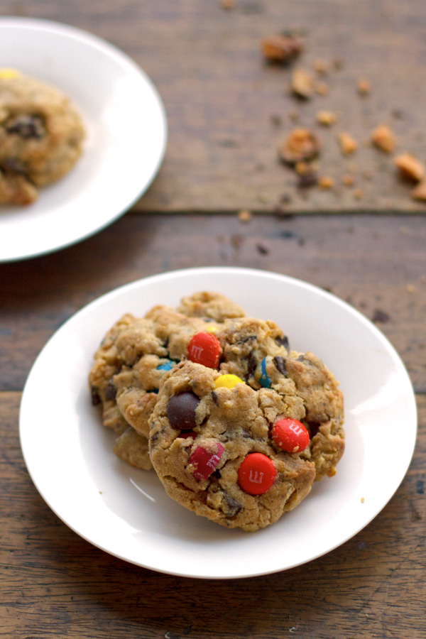 These Butterfinger monster cookies are so addicting! Made with peanut butter, M&Ms, and crushed Butterfinger candy bars. YUM.