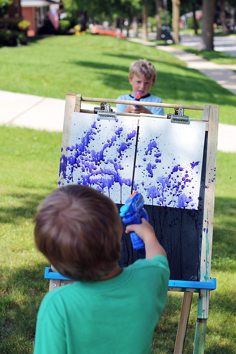 Squirt gun painting is a thrilling summer art experience for kids and the ultimate boredom buster! 