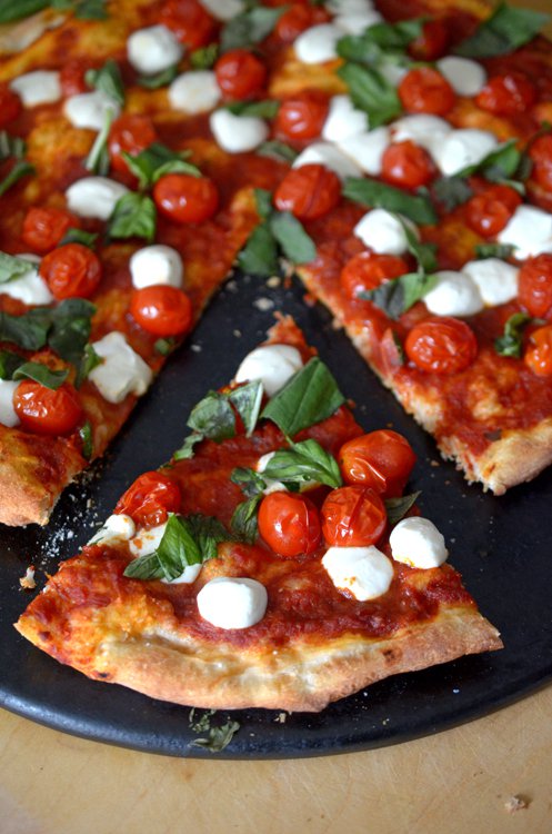 This easy Margherita pizza recipe is ready in under 30 minutes and you’ve probably already have most of the homemade pizza ingredients needed for this one.